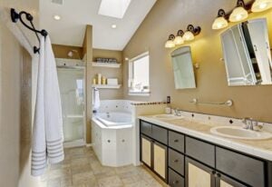 Spacious bathroom with tub, and warm lighting in Toronto, ON